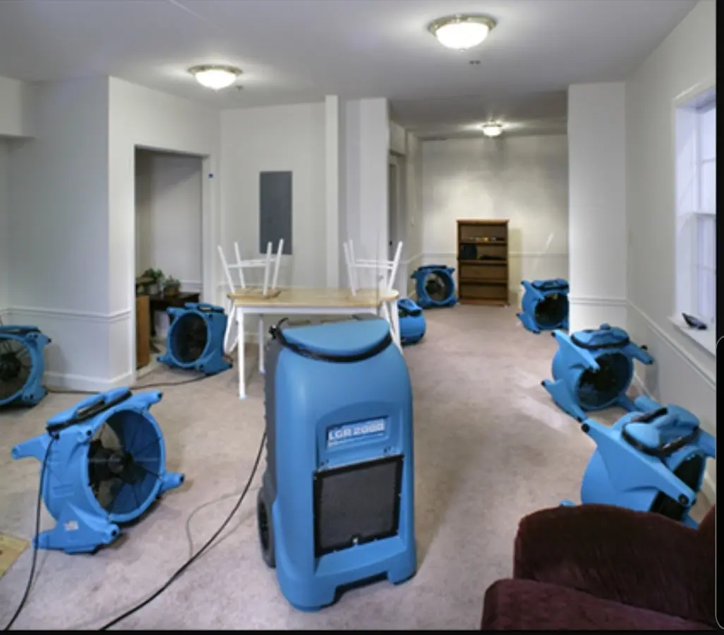 Air movers and dehumidifier setup for Water Damage Restoration in Corcoran